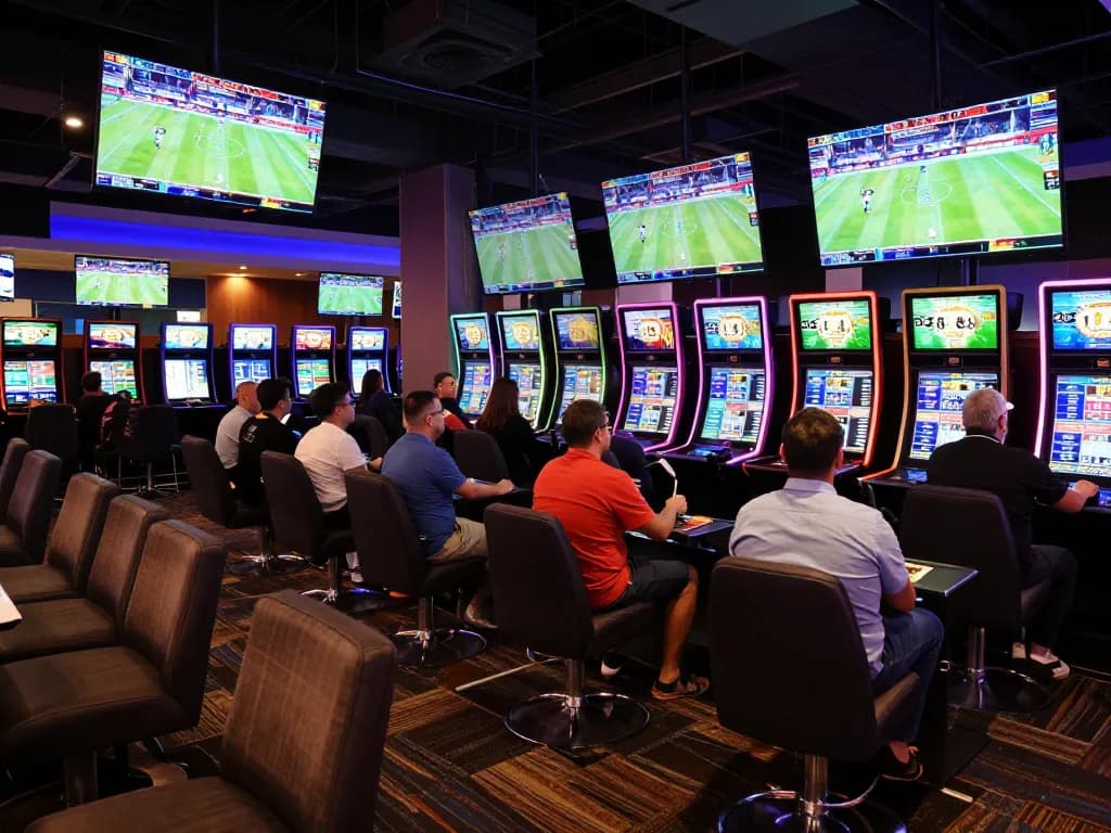 Fabet bettors analyzing odds and placing wagers in a lively casino environment